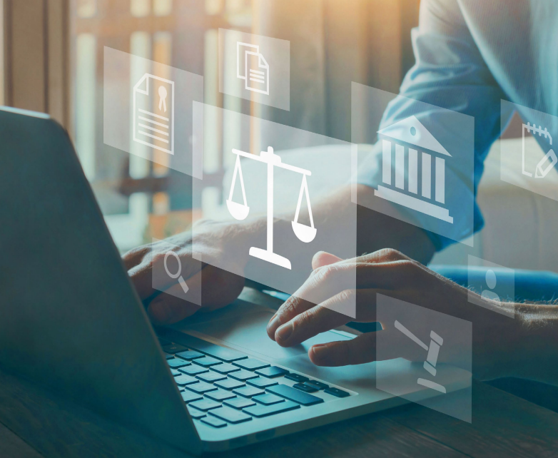 Hands on laptop keyboard with legal icons